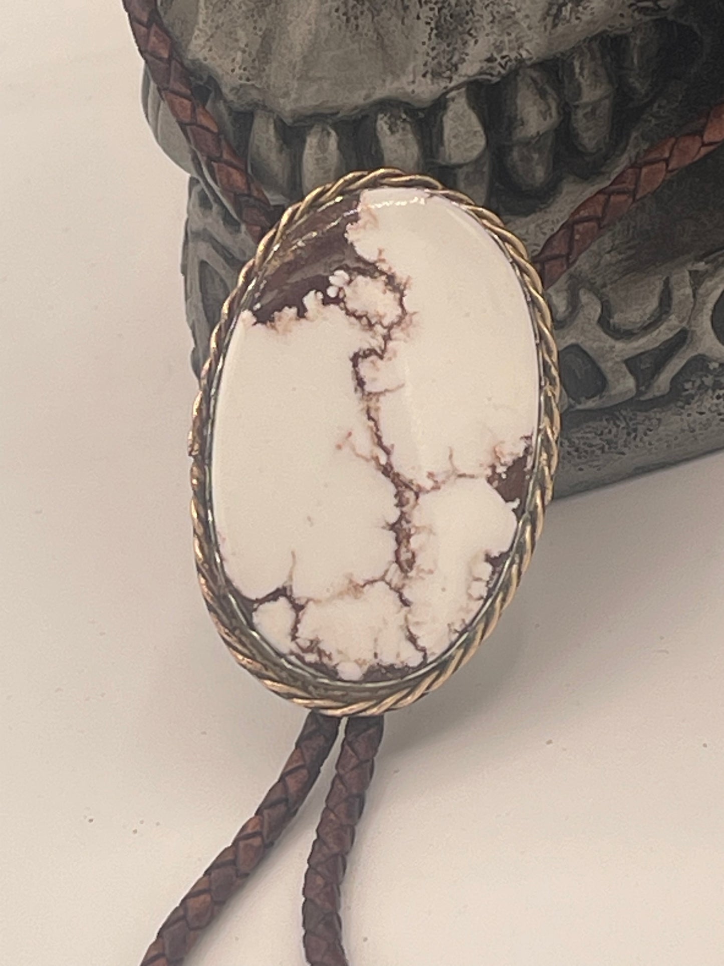 White Buffalo Turquoise Bolo Tie with Gold Wrap and Sterling Silver Mount