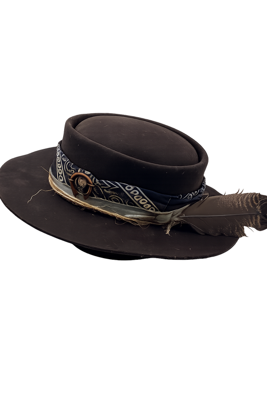 Black cowboy hat with bandana and feather on a white background